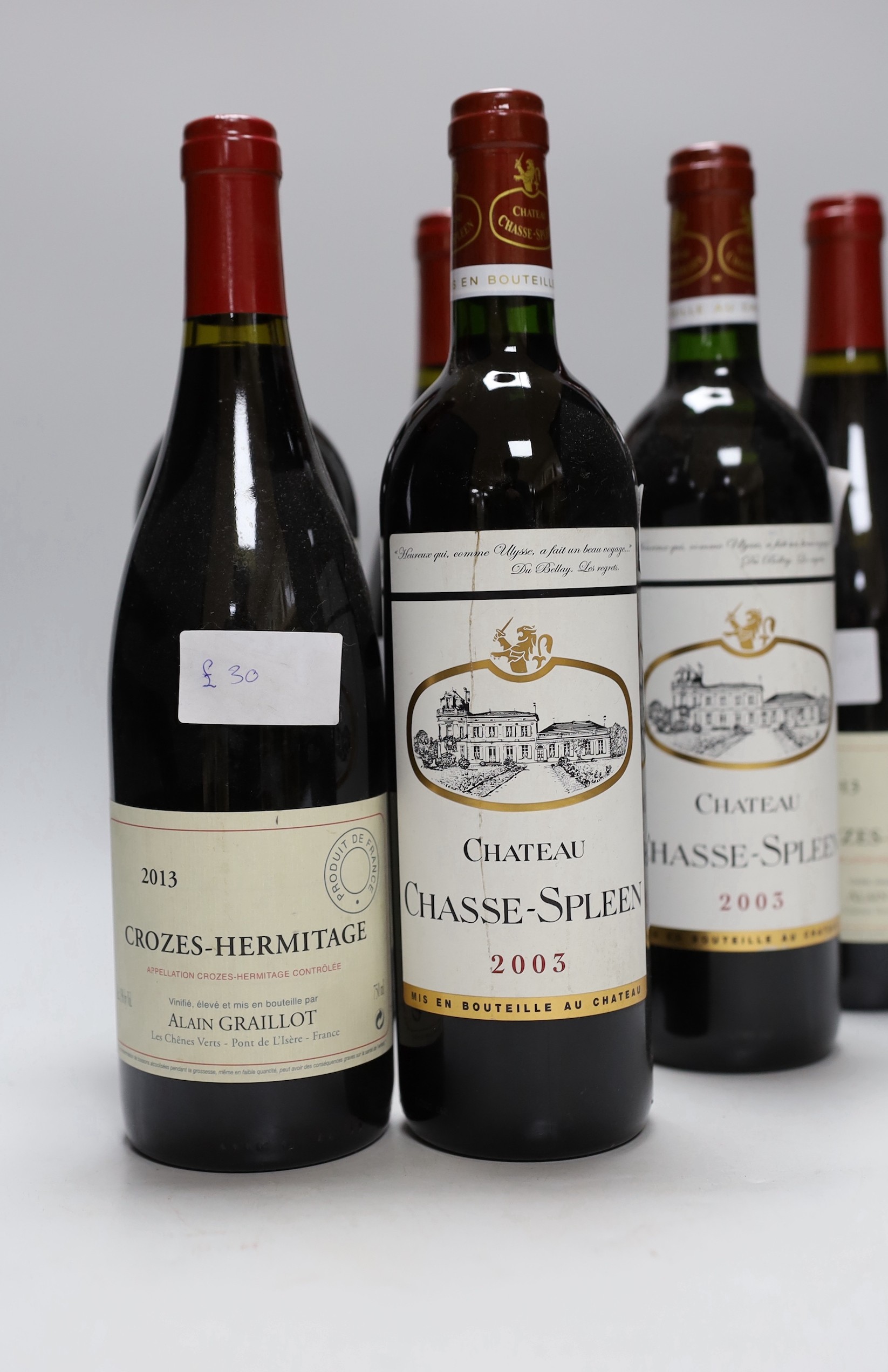 Three bottles of Crozes-Hermitage 2013 and three bottles of Chateau Chase-Spleen 2003